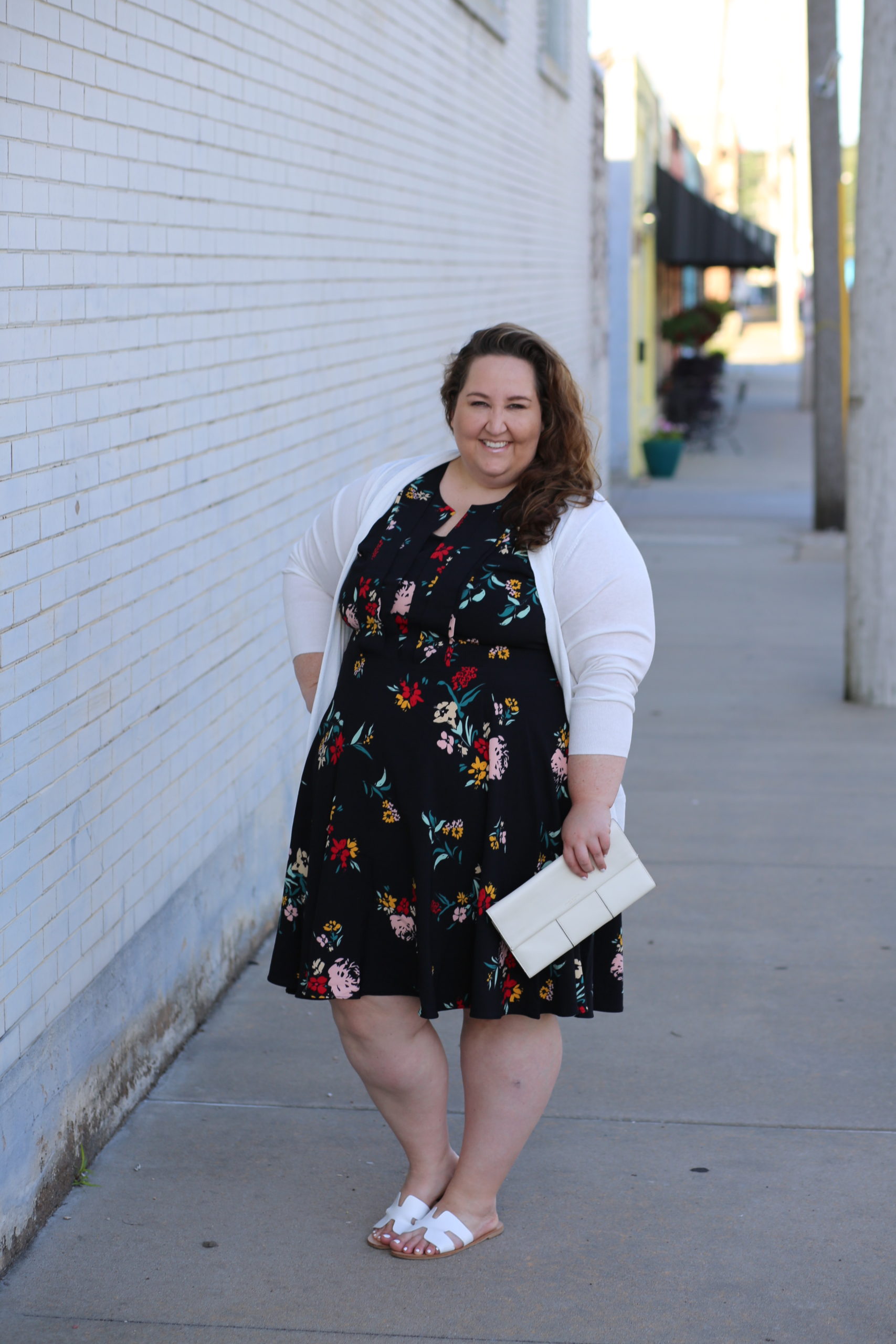 floral dress, plus size style, white cardigan, white clutch, white sandals, dia & co.